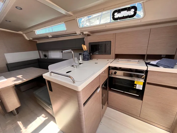 Sfo 418 #289 In Stock Yacht Photos Pics Modern kitchen area in 2023 Hanse 418 yacht with sleek cabinetry and appliances.