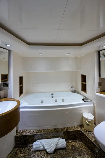 Grandeur Yacht Photos Pics Luxurious bathroom on 2005 DMB Danube Motor Yacht with jacuzzi and elegant design.