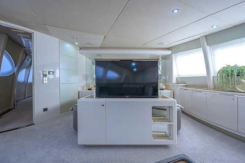 Grandeur Yacht Photos Pics Luxurious interior of 2005 DMB Danube Motor Yacht with modern TV and elegant furnishings.