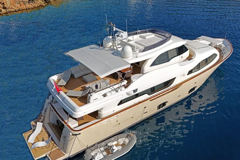  Yacht Photos Pics Luxurious 2011 Custom Line Navetta 26 yacht on serene blue waters.