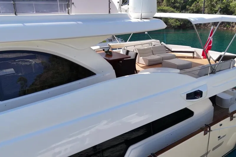  Yacht Photos Pics Luxurious 2011 Custom Line Navetta 26 yacht with spacious deck and elegant seating area.