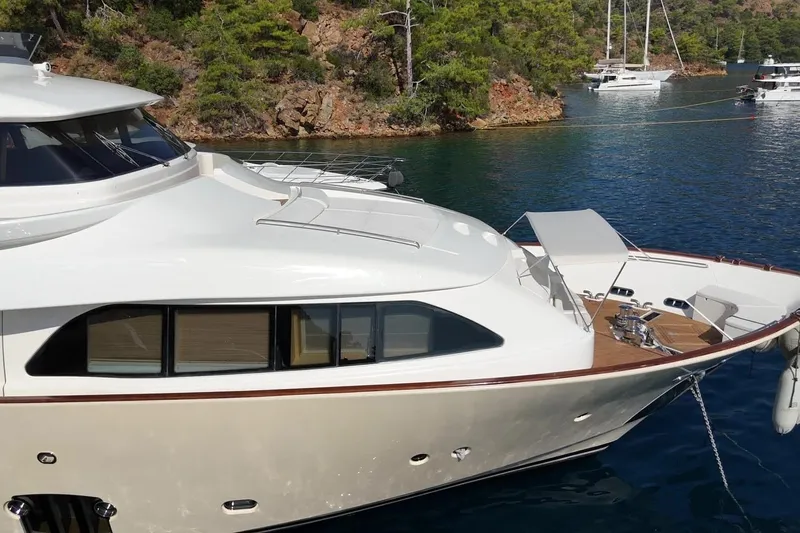  Yacht Photos Pics Luxurious 2011 Custom Line Navetta 26 yacht anchored in scenic bay.