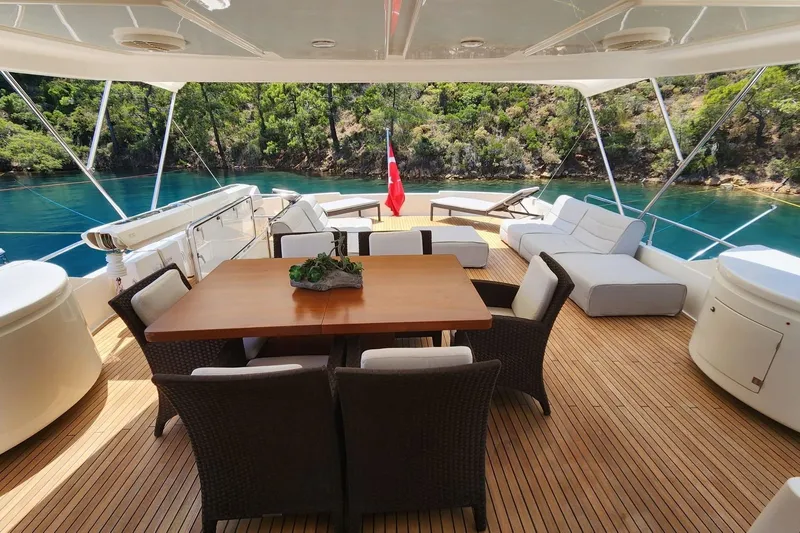  Yacht Photos Pics Luxurious 2011 Custom Line Navetta 26 yacht deck with elegant seating and scenic water view.