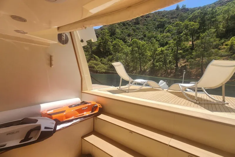  Yacht Photos Pics Luxurious 2011 Custom Line Navetta 26 yacht deck with sun loungers and scenic view.