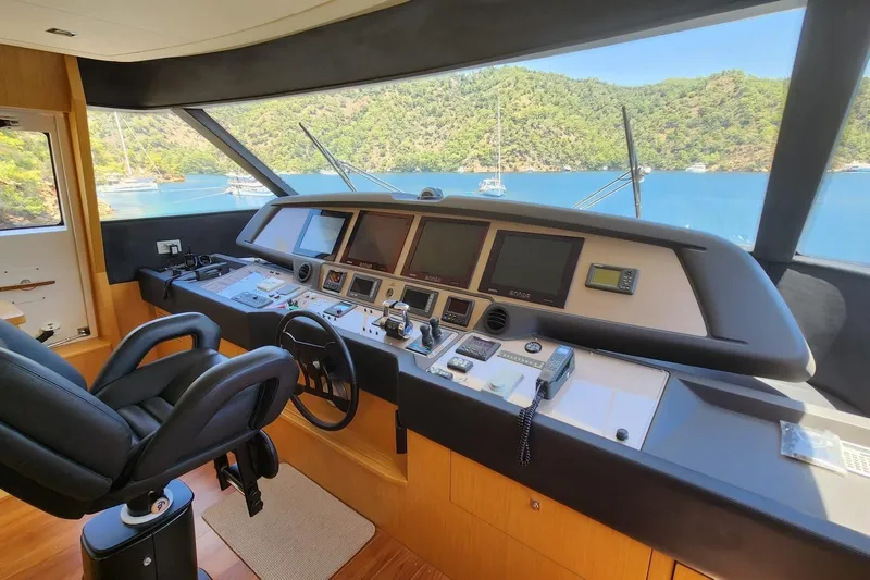  Yacht Photos Pics Helm of 2011 Custom Line Navetta 26 yacht with scenic ocean view.