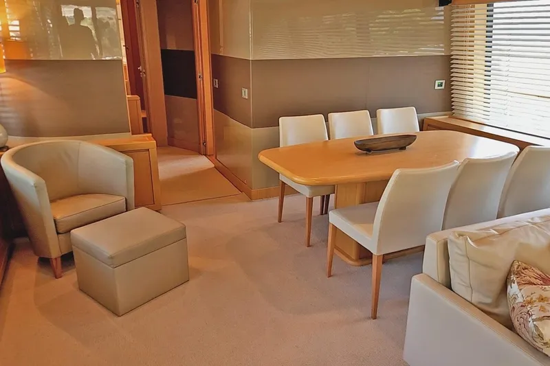  Yacht Photos Pics Luxurious interior of 2011 Custom Line Navetta 26 yacht with elegant dining area and seating.