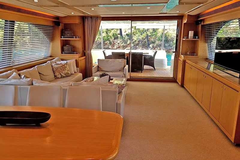  Yacht Photos Pics Luxurious interior of 2011 Custom Line Navetta 26 yacht with elegant seating and large windows.