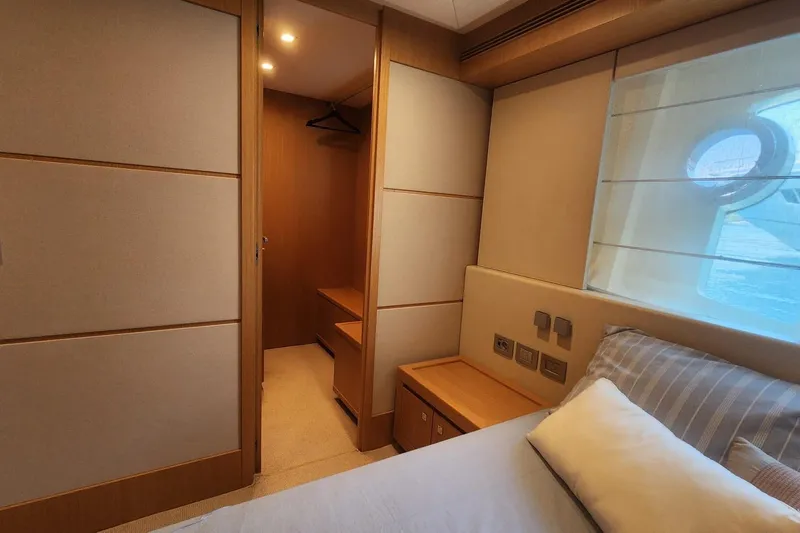  Yacht Photos Pics Luxurious bedroom interior of 2011 Custom Line Navetta 26 yacht with elegant wood finishes.