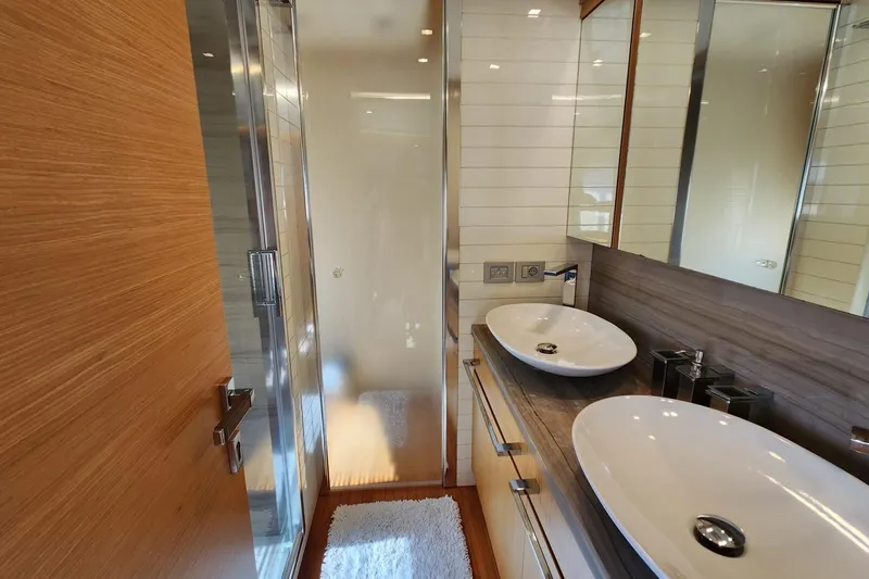  Yacht Photos Pics Luxurious bathroom on 2011 Custom Line Navetta 26 yacht with dual sinks and modern design.