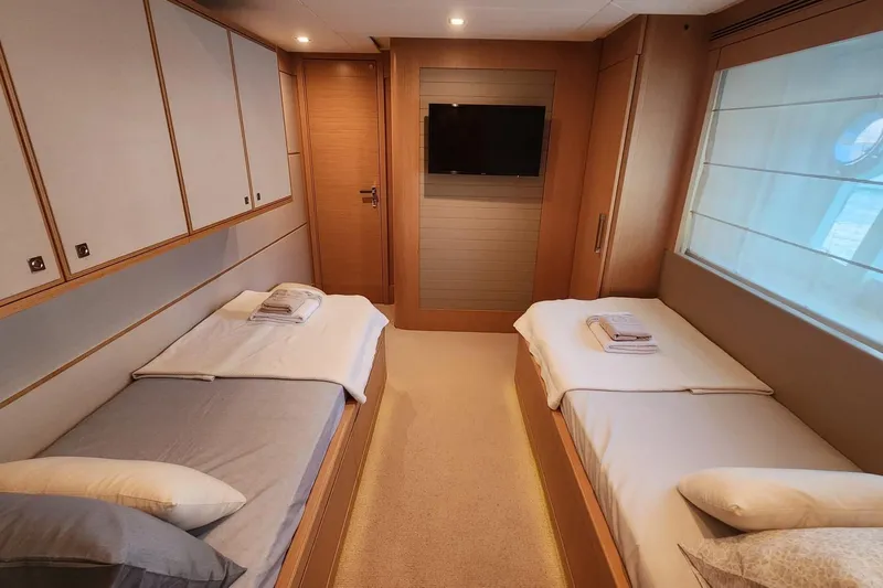  Yacht Photos Pics Luxurious twin cabin interior on 2011 Custom Line Navetta 26 yacht, featuring modern design and amenities.