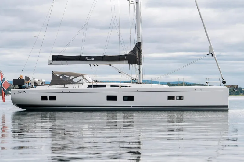  Yacht Photos Pics 2019 Hanse 548 sailboat on calm water, featuring sleek design and modern sails.