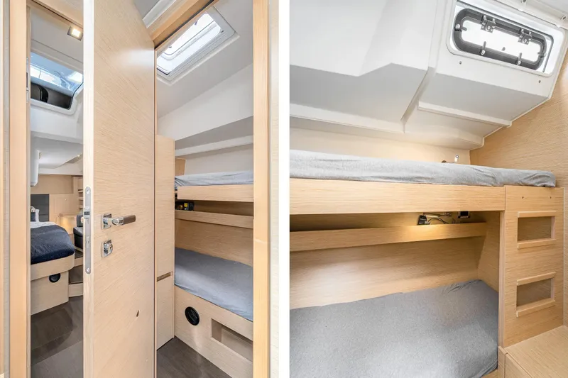  Yacht Photos Pics 2019 Hanse 548 yacht interior with cozy bunk beds and modern wooden finish.