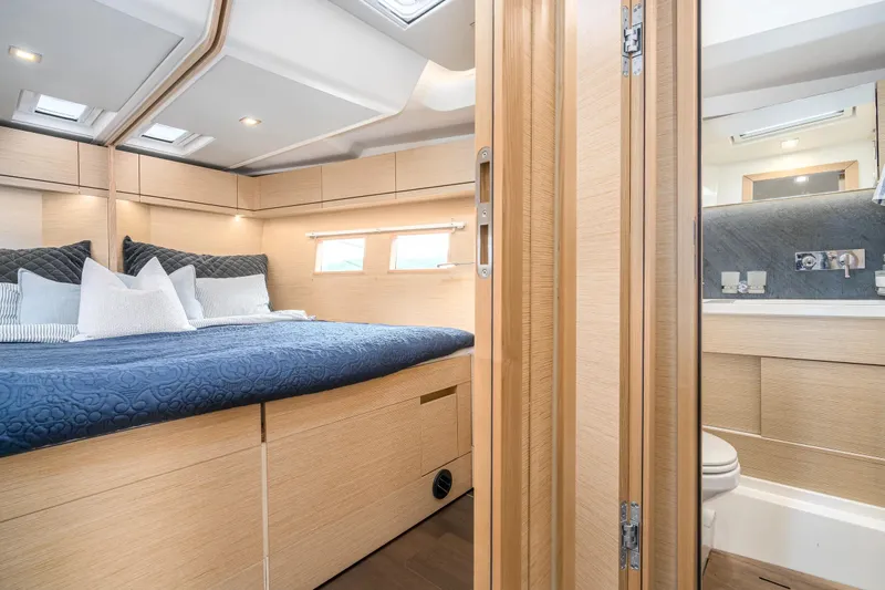  Yacht Photos Pics Luxurious 2019 Hanse 548 yacht cabin with cozy bed and modern ensuite bathroom.