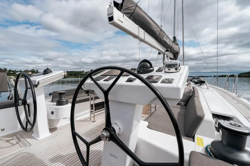  Yacht Photos Pics 2019 Hanse 548 yacht cockpit with dual steering wheels and modern navigation equipment.