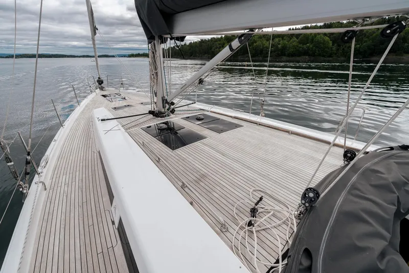  Yacht Photos Pics 2019 Hanse 548 sailboat deck with sleek design on calm waters.