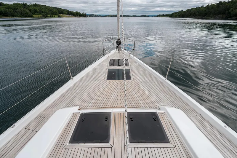  Yacht Photos Pics Deck view of 2019 Hanse 548 yacht sailing on calm waters.