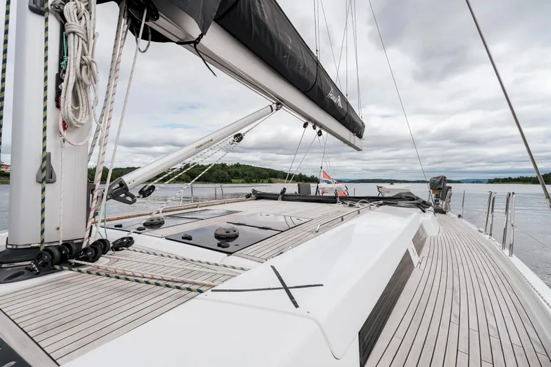  Yacht Photos Pics 2019 Hanse 548 yacht deck with sleek design and scenic water view.
