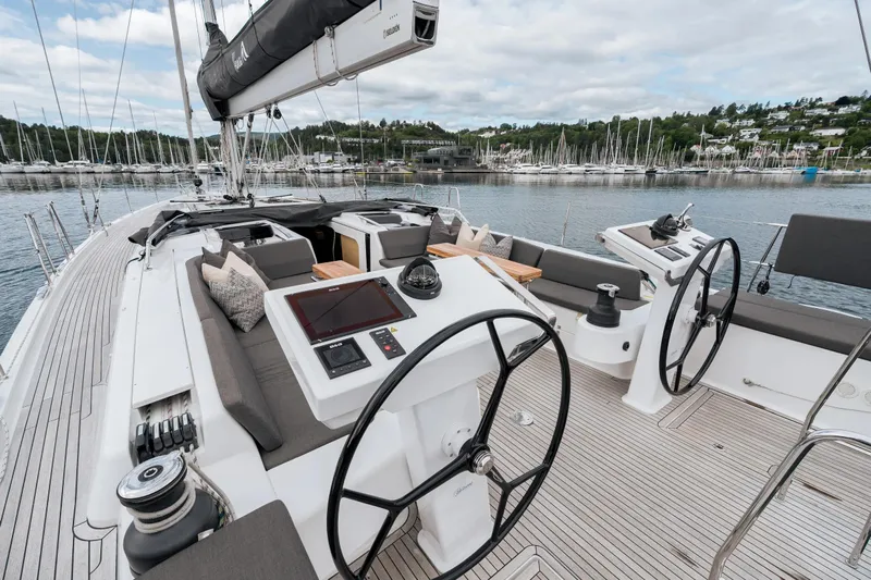 Yacht Photos Pics Luxurious 2019 Hanse 548 yacht cockpit with dual steering wheels and modern navigation equipment.