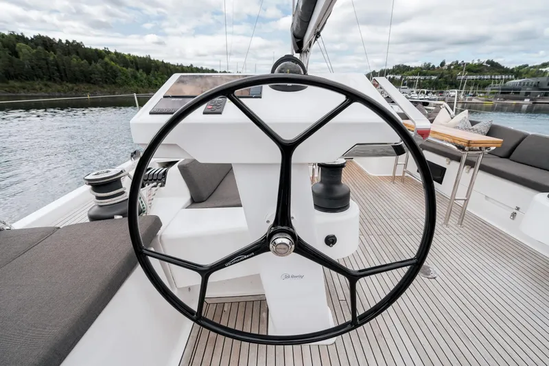  Yacht Photos Pics Steering wheel of 2019 Hanse 548 yacht, featuring sleek design and spacious deck.