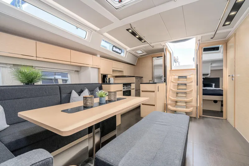  Yacht Photos Pics Luxurious interior of 2019 Hanse 548 yacht with modern furnishings and ample natural light.
