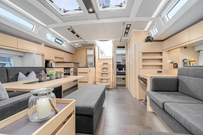 Yacht Photos Pics Luxurious interior of 2019 Hanse 548 yacht with modern furnishings and ample natural light.