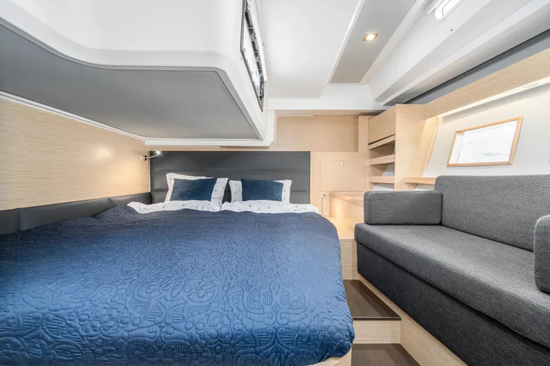  Yacht Photos Pics Luxurious interior of 2019 Hanse 548 yacht with cozy bed and modern sofa.