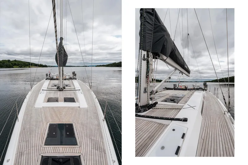  Yacht Photos Pics 2019 Hanse 548 yacht on calm waters, showcasing sleek deck design and modern sail rigging.