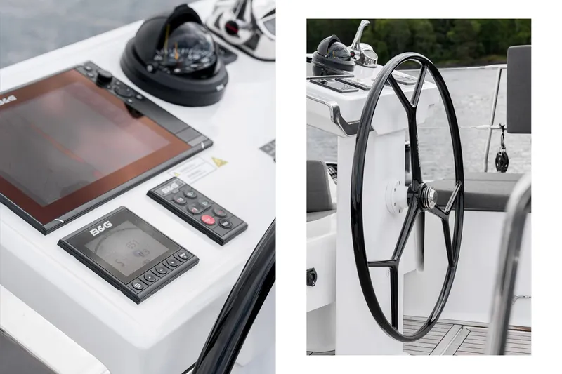  Yacht Photos Pics 2019 Hanse 548 yacht helm with navigation instruments and steering wheel.
