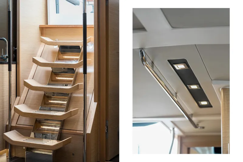  Yacht Photos Pics Modern interior of 2019 Hanse 548 yacht featuring sleek wooden stairs and ceiling lights.