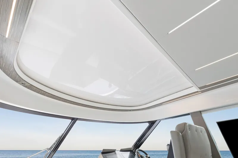 Segers Marine Yacht Photos Pics Interior view of 2019 Tiara Yachts C49 Coupe with sleek modern design and ocean backdrop.