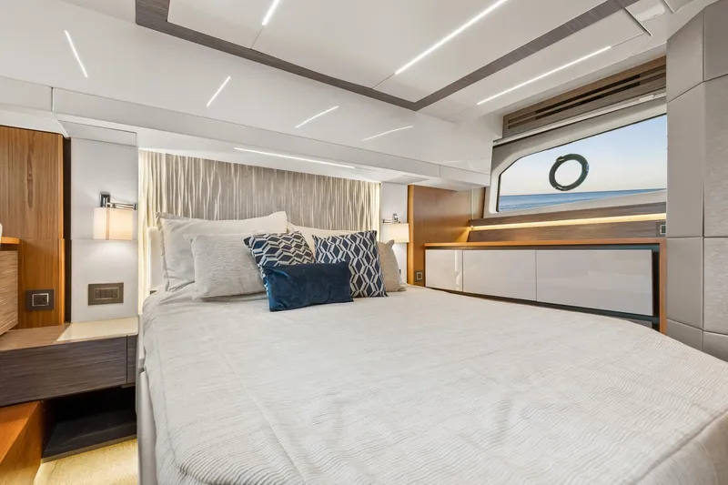 Segers Marine Yacht Photos Pics Luxurious bedroom interior of 2019 Tiara Yachts C49 Coupe with ocean view.