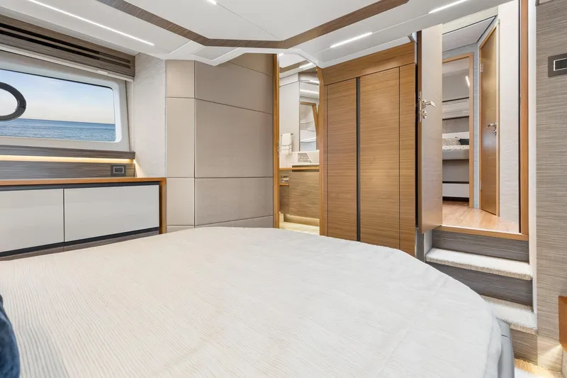 Segers Marine Yacht Photos Pics Luxurious interior of 2019 Tiara Yachts C49 Coupe, featuring elegant wood finishes and ocean view.