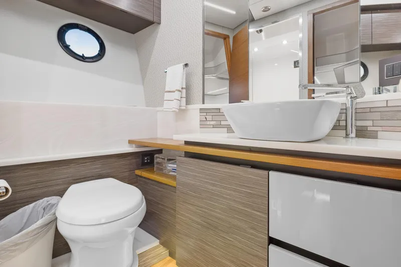 Segers Marine Yacht Photos Pics Luxurious bathroom in 2019 Tiara Yachts C49 Coupe, featuring modern fixtures and elegant design.