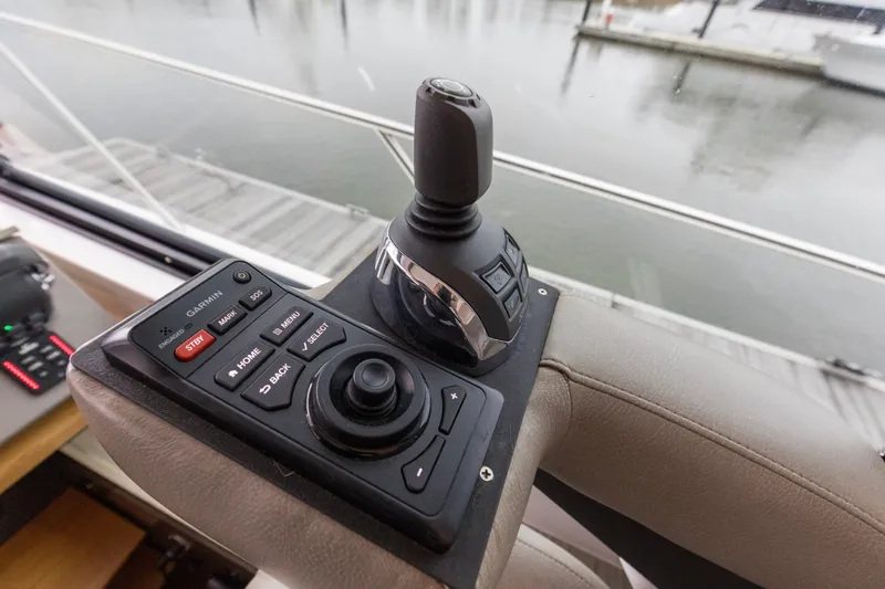 Segers Marine Yacht Photos Pics Control panel of 2019 Tiara Yachts C49 Coupe with joystick and Garmin interface.