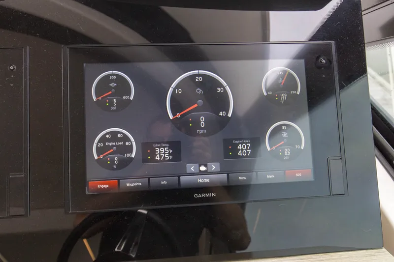 Segers Marine Yacht Photos Pics Dashboard display of a 2019 Tiara Yachts C49 Coupe, featuring engine gauges and controls.