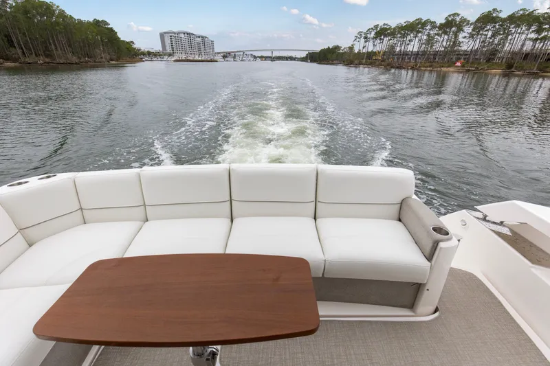 Segers Marine Yacht Photos Pics 2019 Tiara Yachts C49 Coupe with white seating and wooden table on open water.