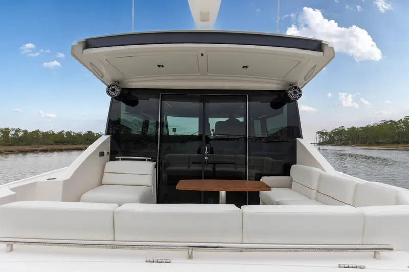 Segers Marine Yacht Photos Pics 2019 Tiara Yachts C49 Coupe with spacious outdoor seating and scenic water view.