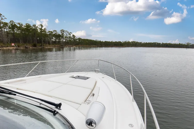 Segers Marine Yacht Photos Pics Bow view of 2019 Tiara Yachts C49 Coupe on serene waterway.