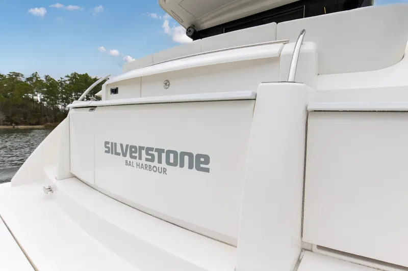Segers Marine Yacht Photos Pics 2019 Tiara Yachts C49 Coupe, rear view with "Silverstone Bal Harbour" text.