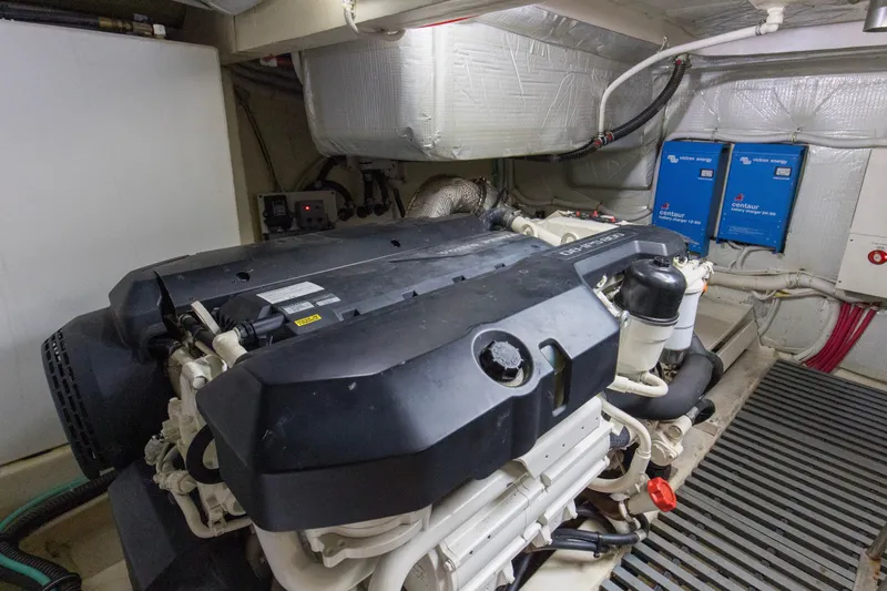 Segers Marine Yacht Photos Pics Engine room of 2019 Tiara Yachts C49 Coupe with visible components and wiring.