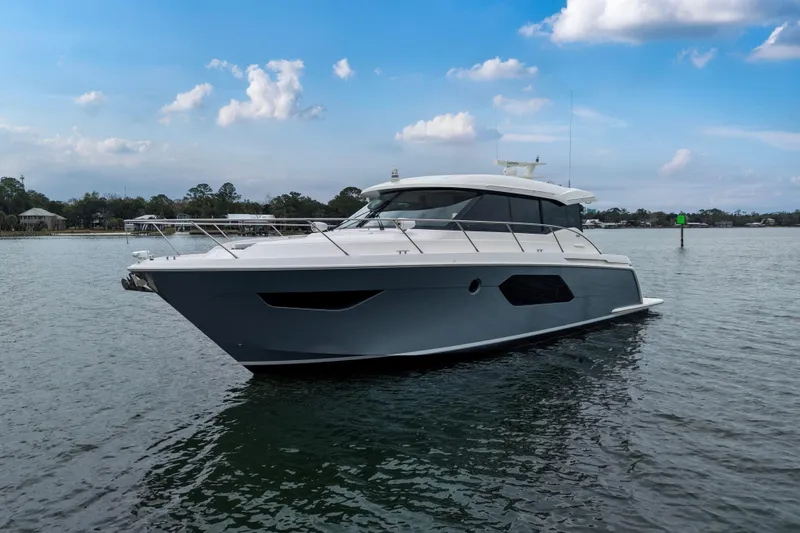 Segers Marine Yacht Photos Pics 2019 Tiara Yachts C49 Coupe on calm water under a blue sky.