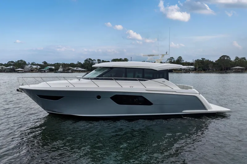 Segers Marine Yacht Photos Pics 2019 Tiara Yachts C49 Coupe on calm water under a blue sky.