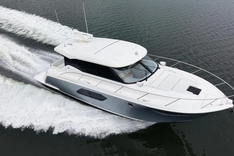 Segers Marine Yacht Photos Pics 2019 Tiara Yachts C49 Coupe cruising on open water, showcasing sleek design and performance.