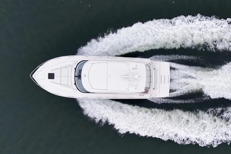 Segers Marine Yacht Photos Pics Aerial view of 2019 Tiara Yachts C49 Coupe cruising on water.