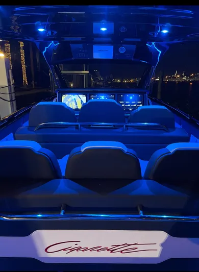  Yacht Photos Pics 2024 Cigarette 42 Auroris boat interior with blue LED lighting at night.