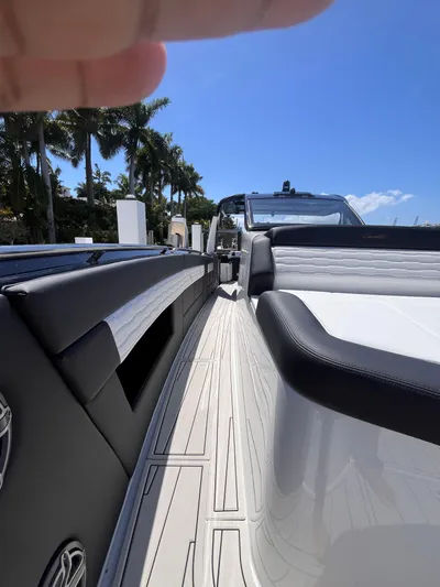  Yacht Photos Pics 2024 Cigarette 42 Auroris luxury boat docked under clear blue sky.