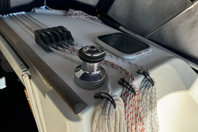 Interlude Yacht Photos Pics Deck of 2002 Beneteau Oceanis 393 sailboat with winch and ropes.