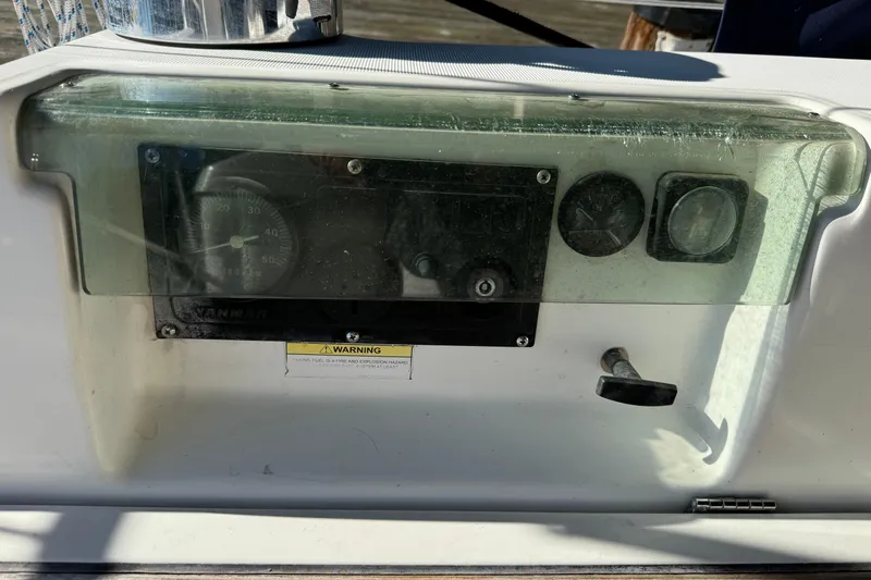 Interlude Yacht Photos Pics Control panel of a 2002 Beneteau Oceanis 393 sailboat with gauges and warning label.