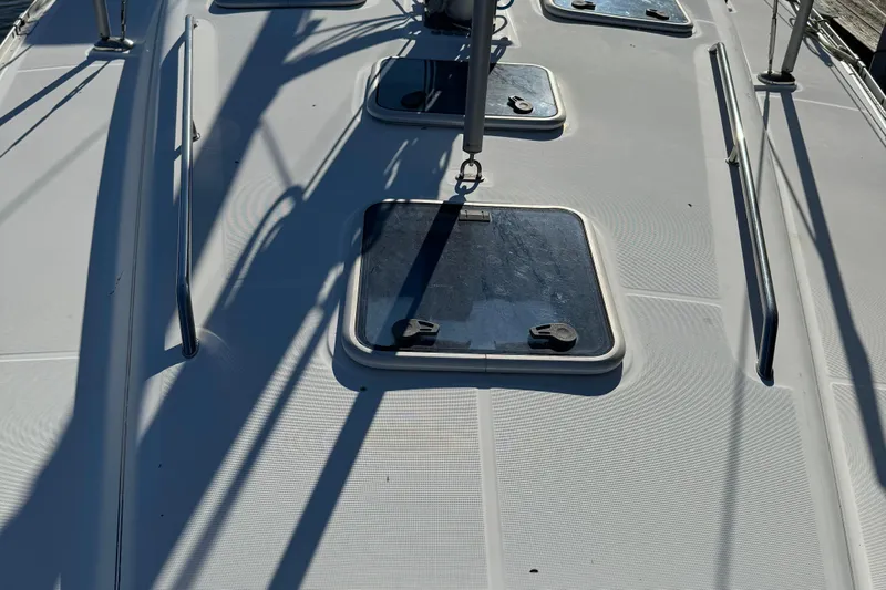 Interlude Yacht Photos Pics Deck of 2002 Beneteau Oceanis 393 sailboat with hatches and railings.