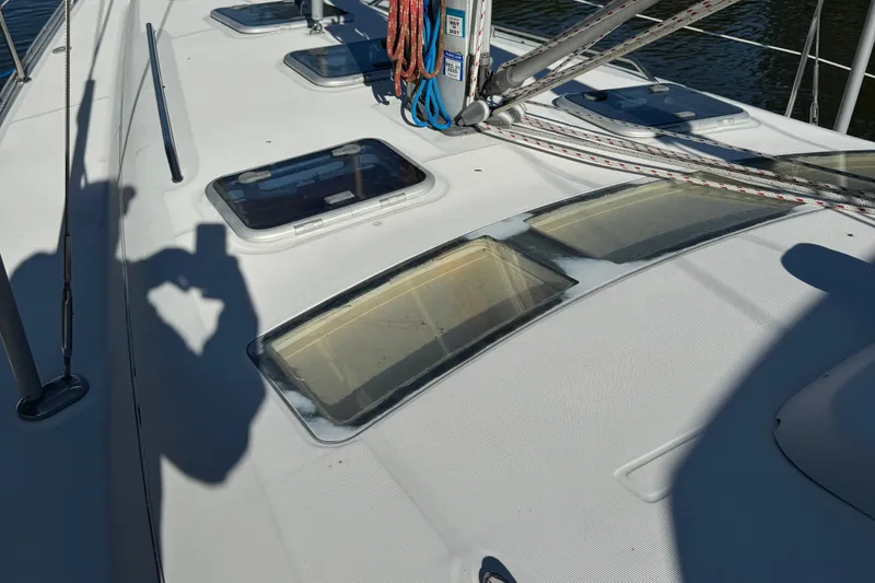 Interlude Yacht Photos Pics Deck of 2002 Beneteau Oceanis 393 sailboat with hatches and rigging.